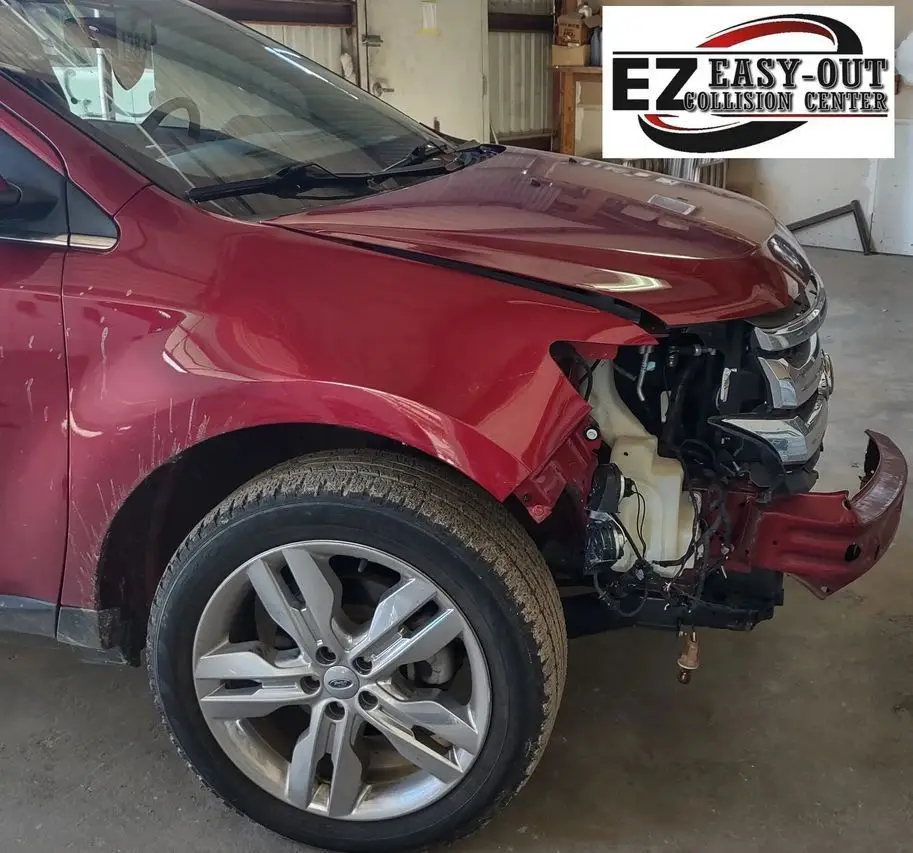 Red Ford Edge with front-end damage, likely after a collision.