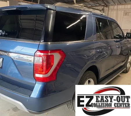 Rear view of a blue Ford Expedition with its quarter panel restored after collision repair